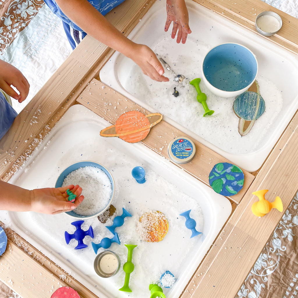 Space themed sensory play activity with galactic dust 