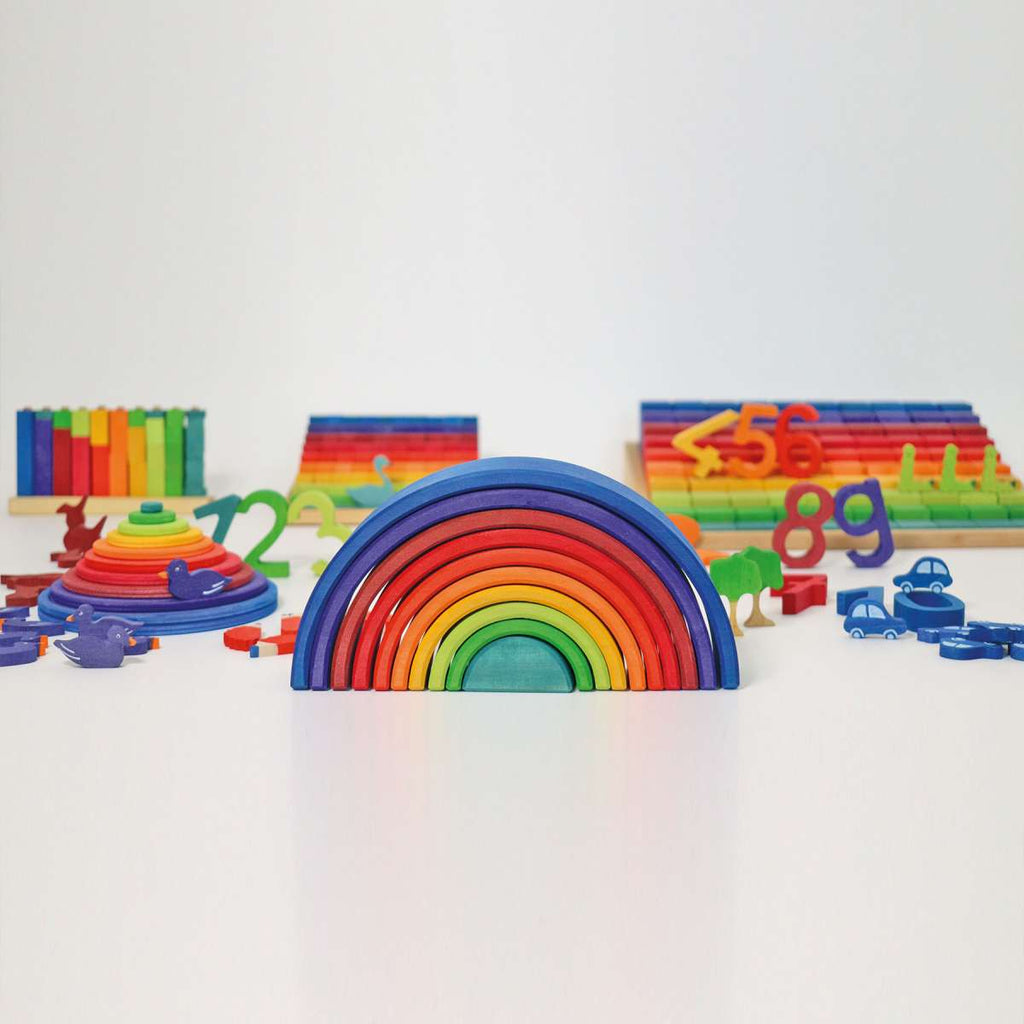 Grimms 2021 Counting Rainbow pictured with other grimms wooden toys