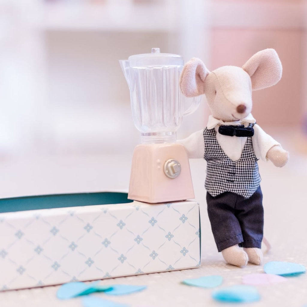 Maileg Waiter Mouse standing next to mini blender sitting on a box with confetti in front