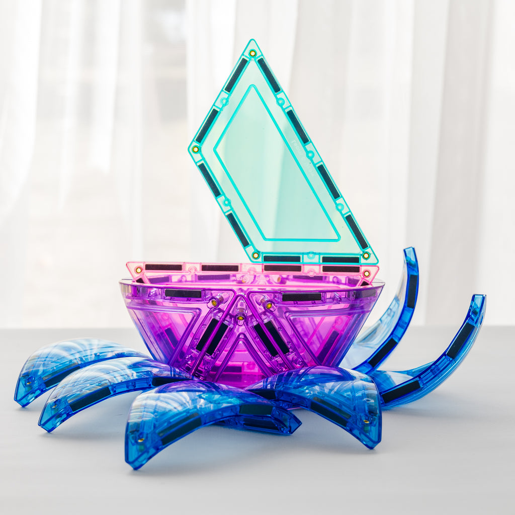 Pastel geometric object with blue, purple, and teal colors on a white background