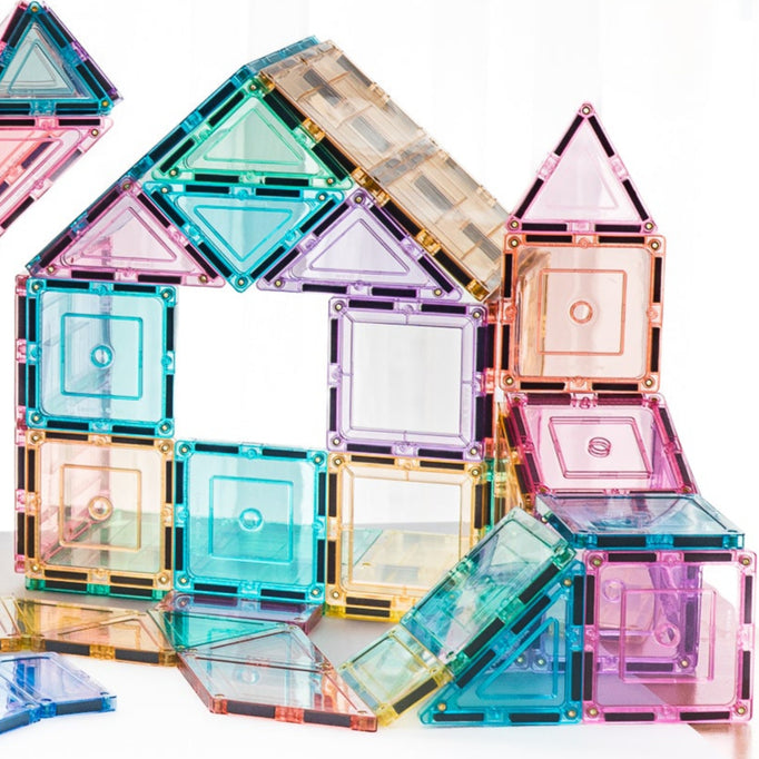 Pastel magnetic building blocks on a white background