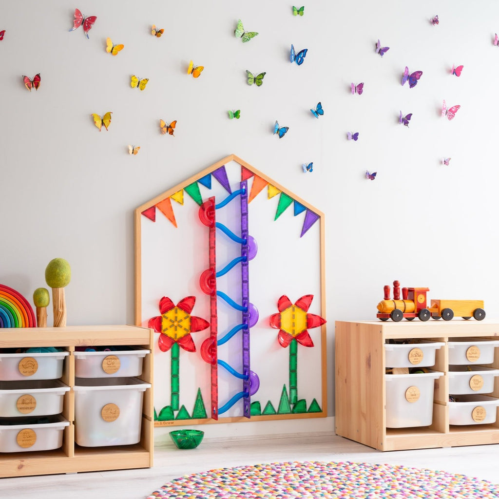 Multi-board with butterflies on wall of playroom