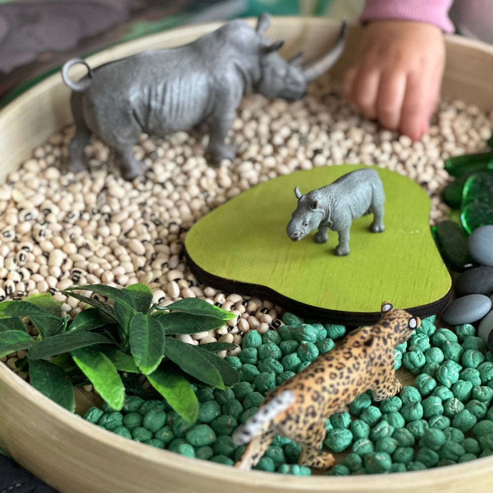 Wild animals from subscription box in sensory play tray