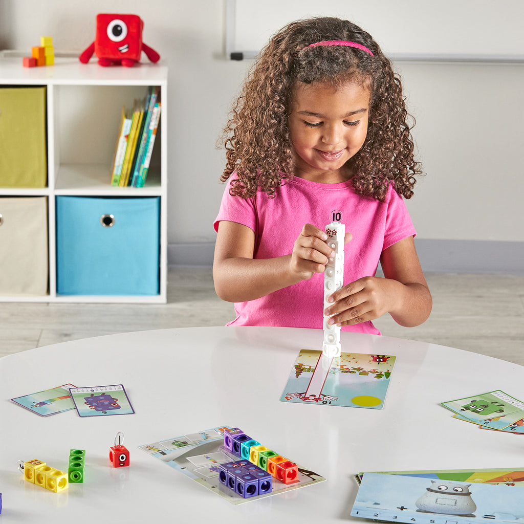 Child playing with NUMBERBLOCKS® MathLink® Cubes 1–10 Activity Set on table