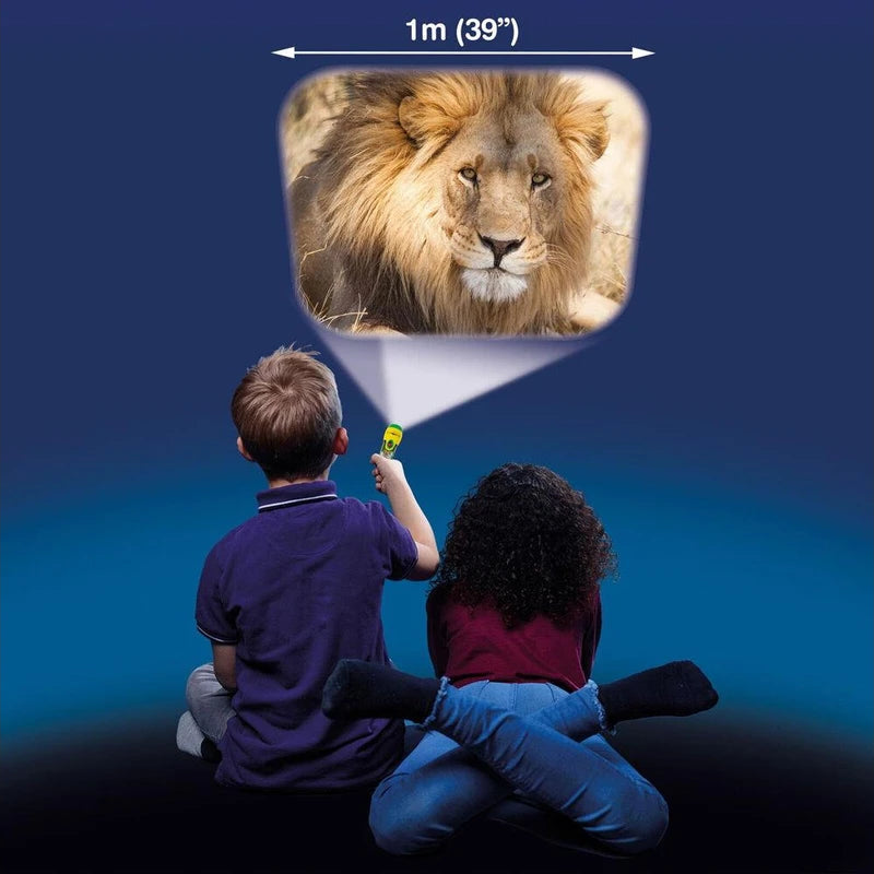 Two children sitting on the ground with a projector displaying an image of a lion against a dark blue background.