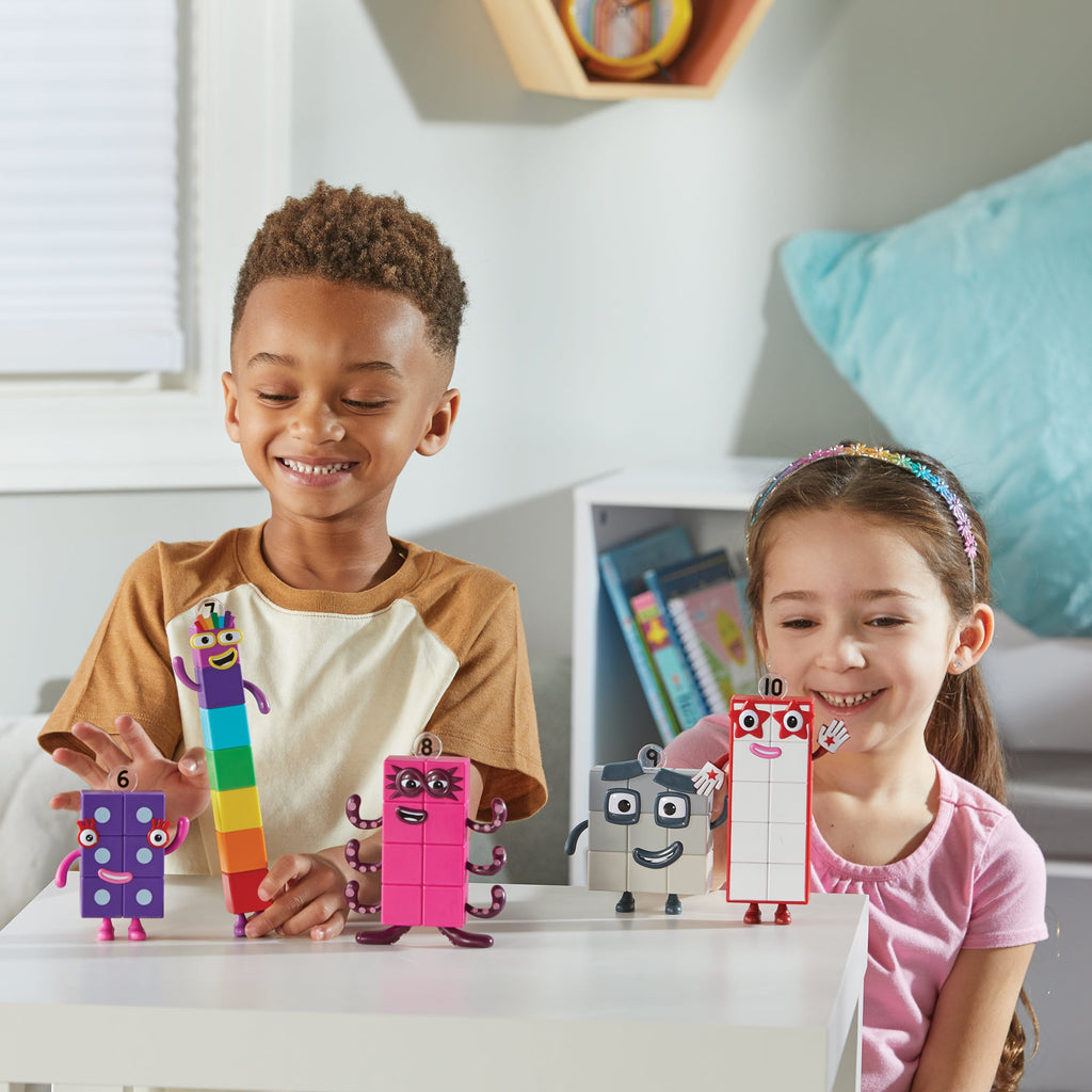 Boy & Girl playing with NUMBERBLOCKS® Friends Six to Ten toys on table