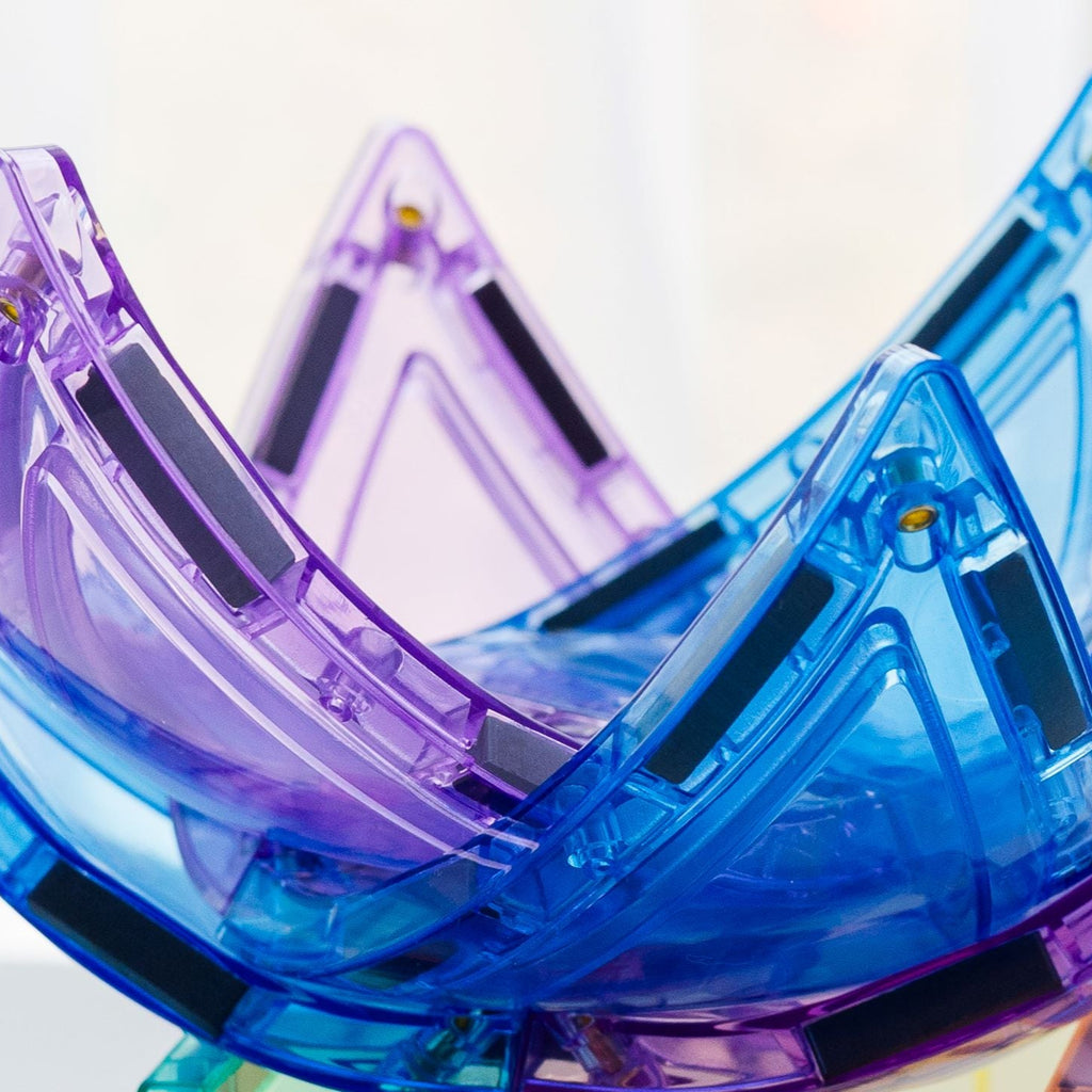 Close up of pastel coloured curved triangles - magnetic tiles