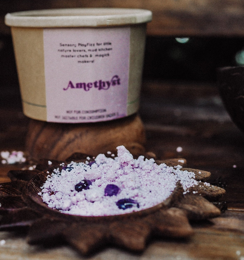 Wild Mountain Child - PlayFizz Crumble - Cup in amethyst shown on a wooden flower dish