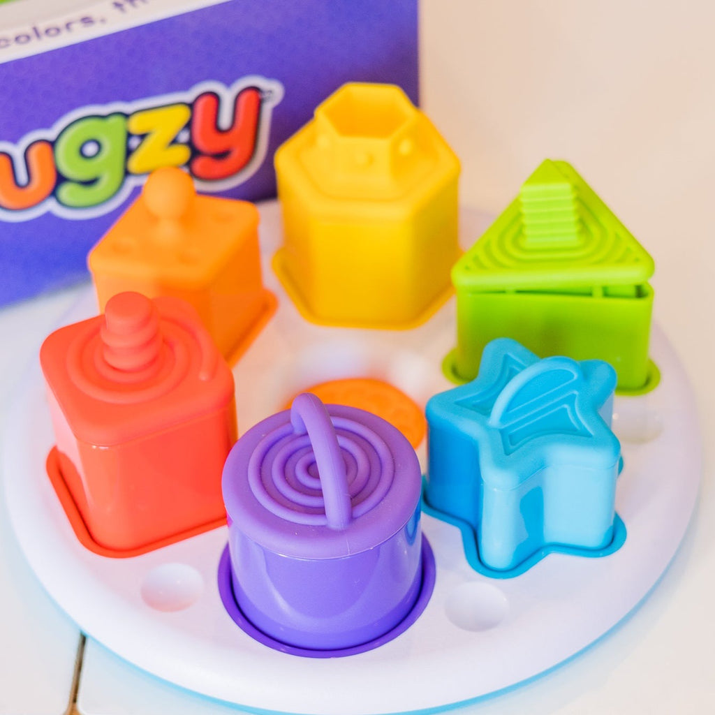 Fat Brain Toys Plugzy displayed on table with box behind