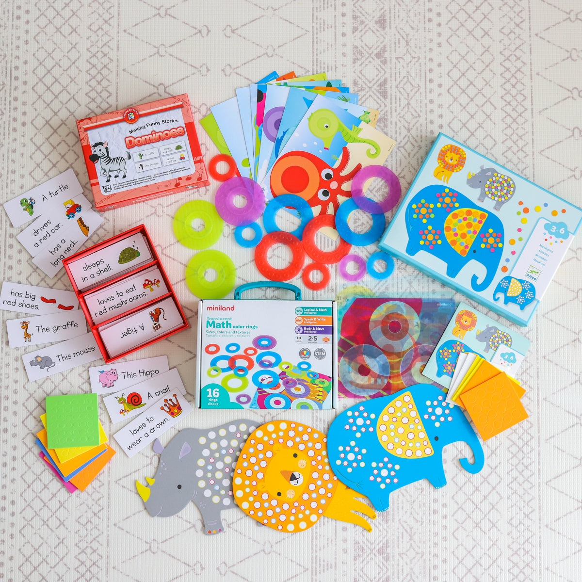 Toys spread out from April Play Subscription box from The Creative Toy Shop