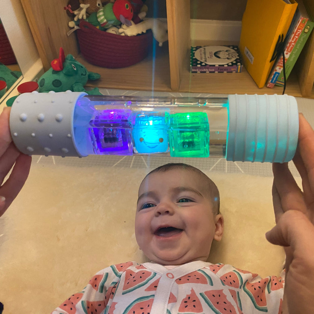Glo Pals used in calm down bottle making baby smile