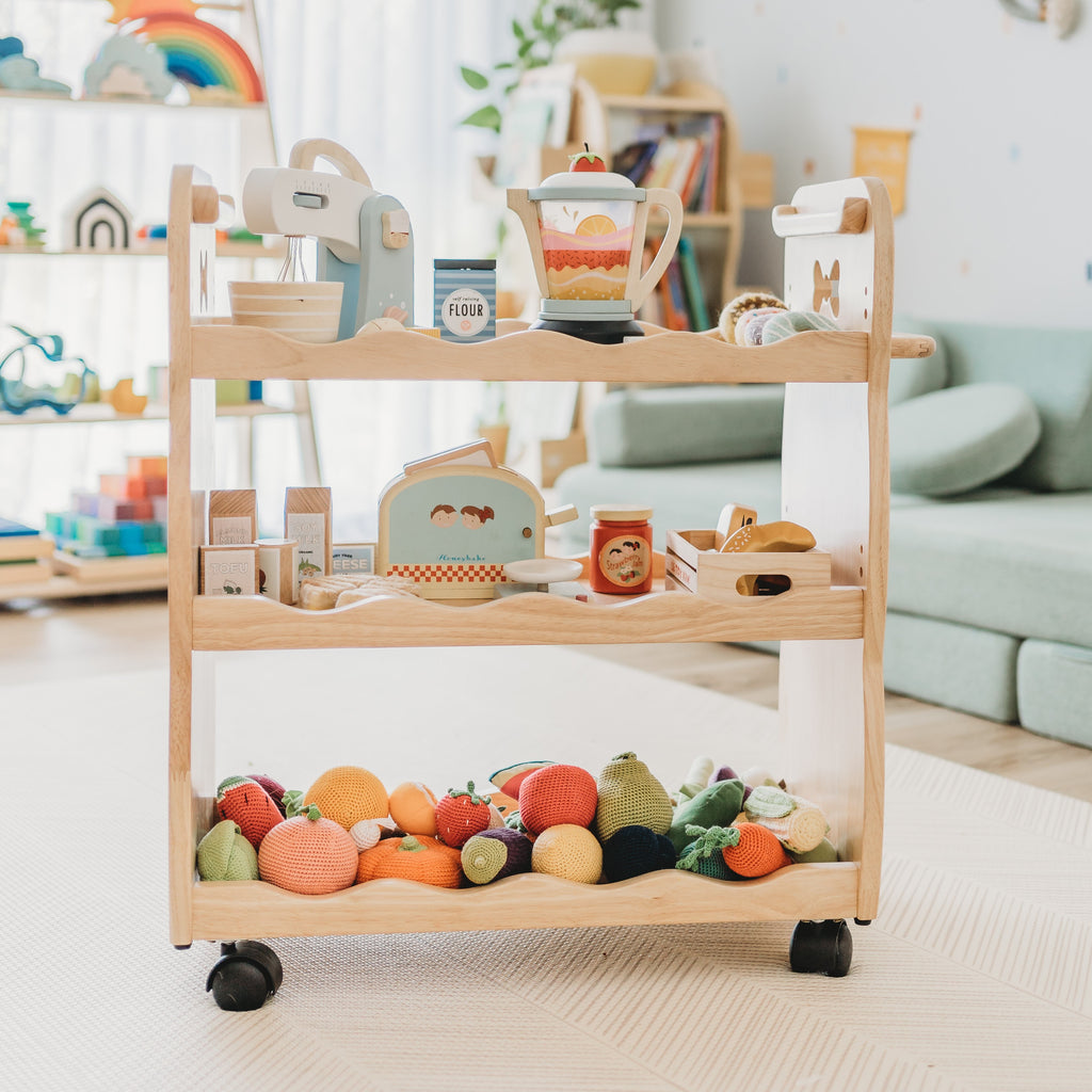Bunny Tickles Solid Wood Trolley displayed with wooden and crochet pretend play room in playroom with light 