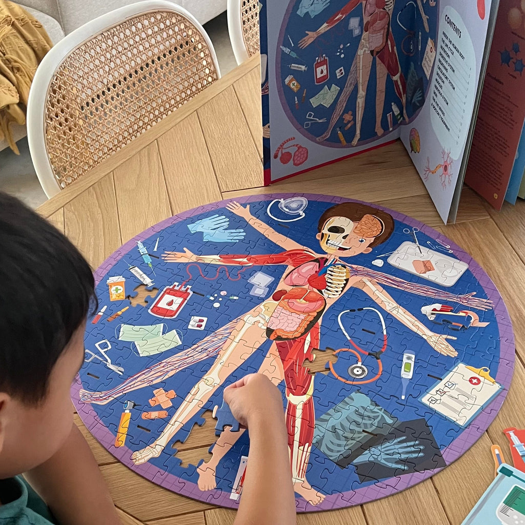 Child playing with All About the Body Puzzle