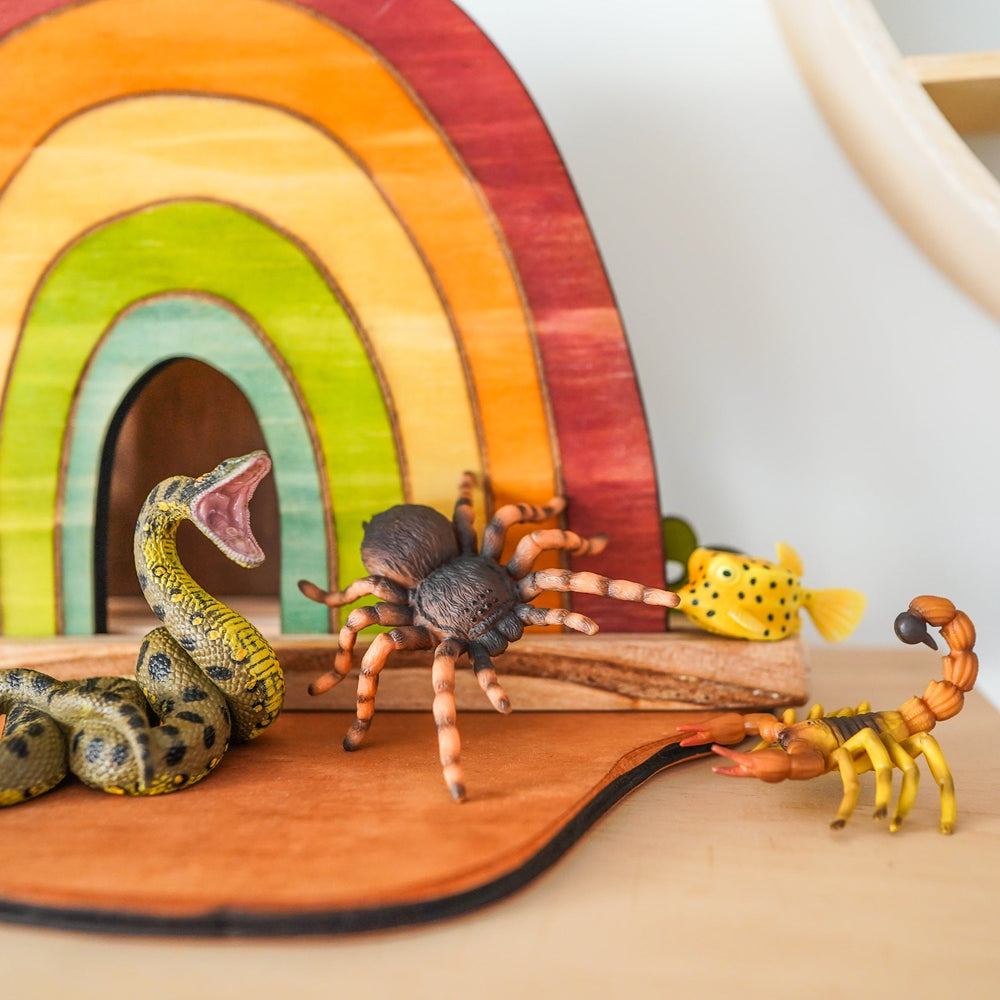 CollectA deadly animals displayed against a wooden rainbow