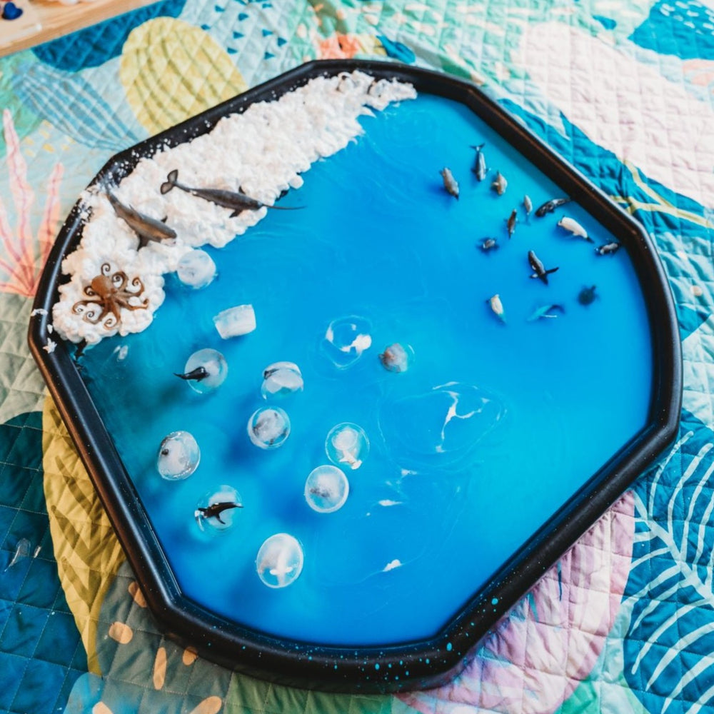Artic sensory play set up with ice and shaving foam with pretty play mat