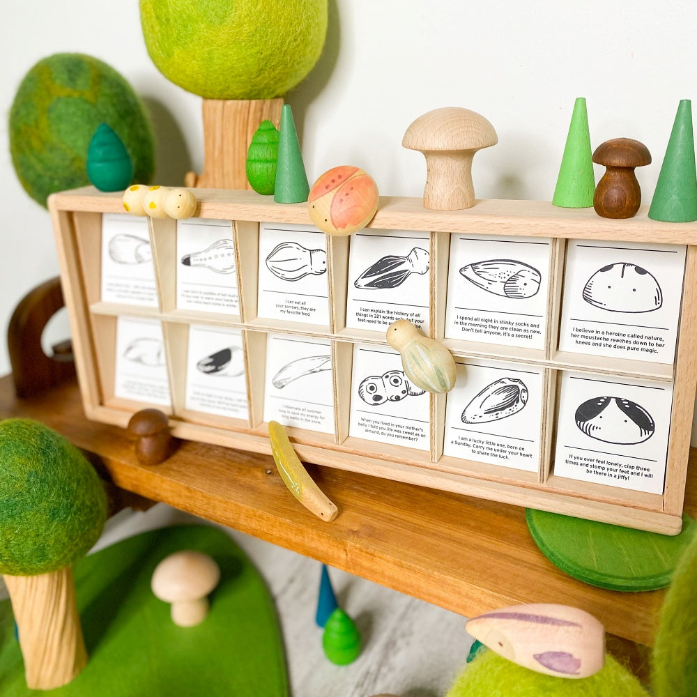 New 2022 Grapat Wild wooden toys in wooden shelf displayed with green felt trees from Papoose