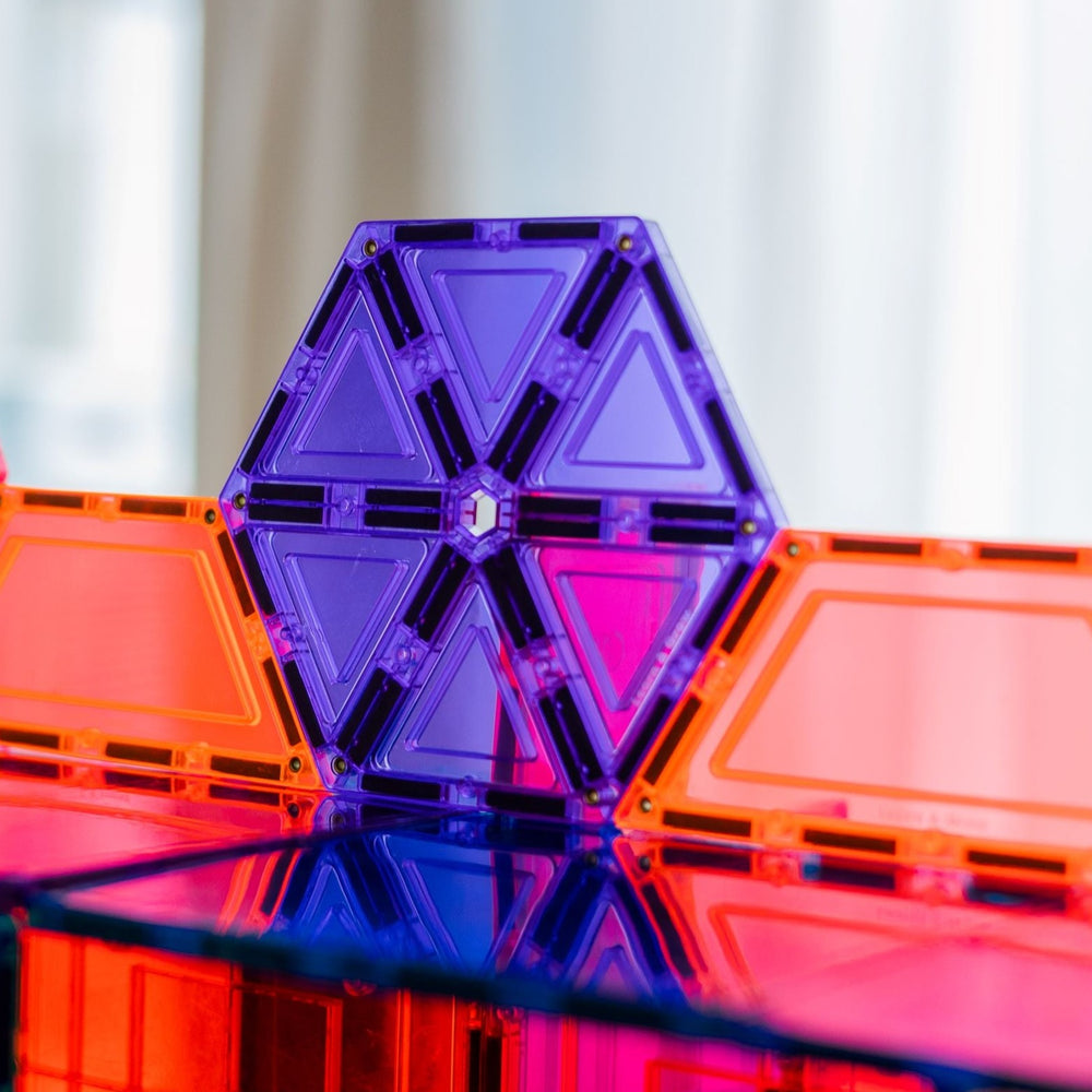 Purple hexagon magnetic tiles with light shining through