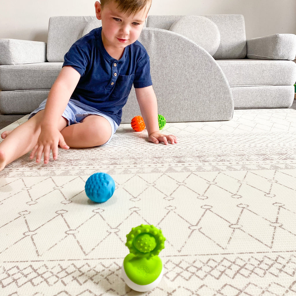 Fat Brain Dimpl Wobl set up game with sensory balls