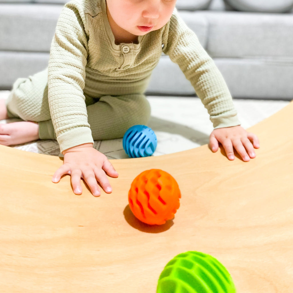 Fat Brain Toys - Sensory Rollers being played with by a toddler