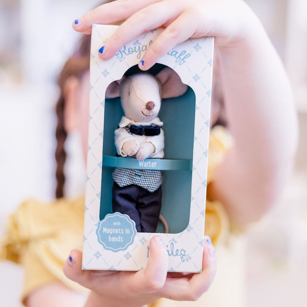 Child holding box of Maileg Waiter mouse in hands