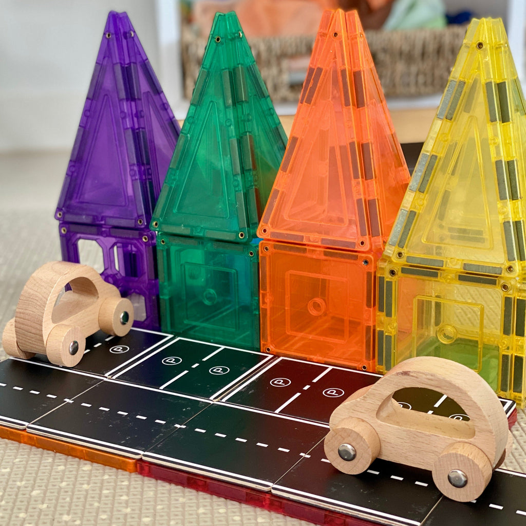 Road toppers used with rainbow magnetic tiles as houses