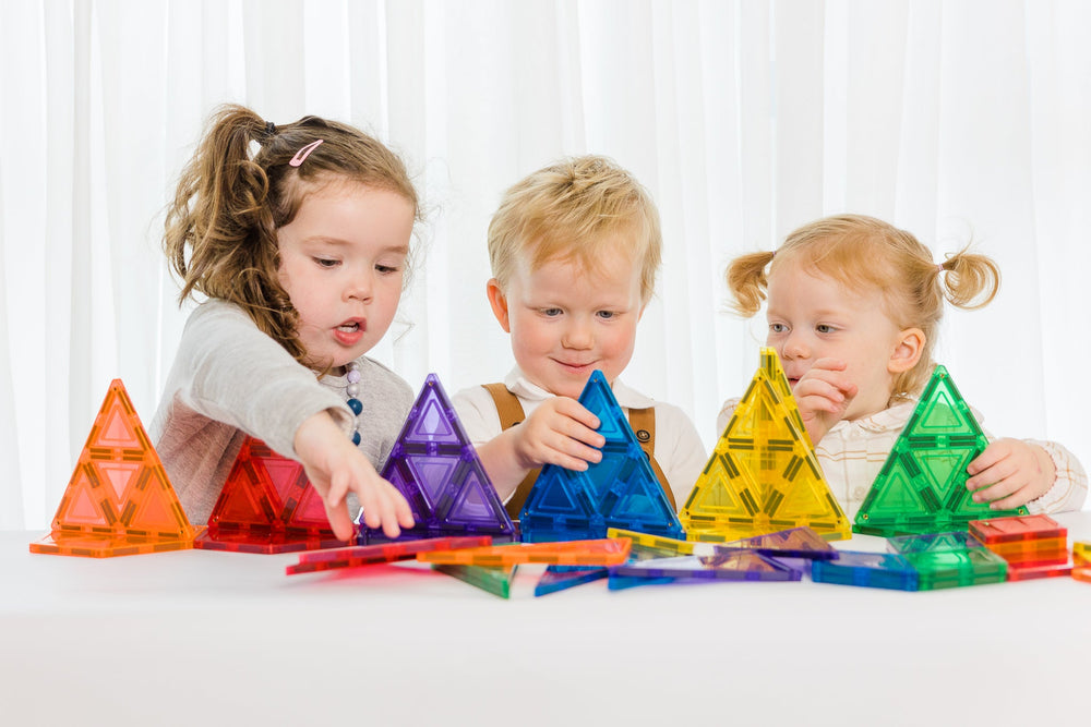 36pc geometry pack being played with by 3 young children