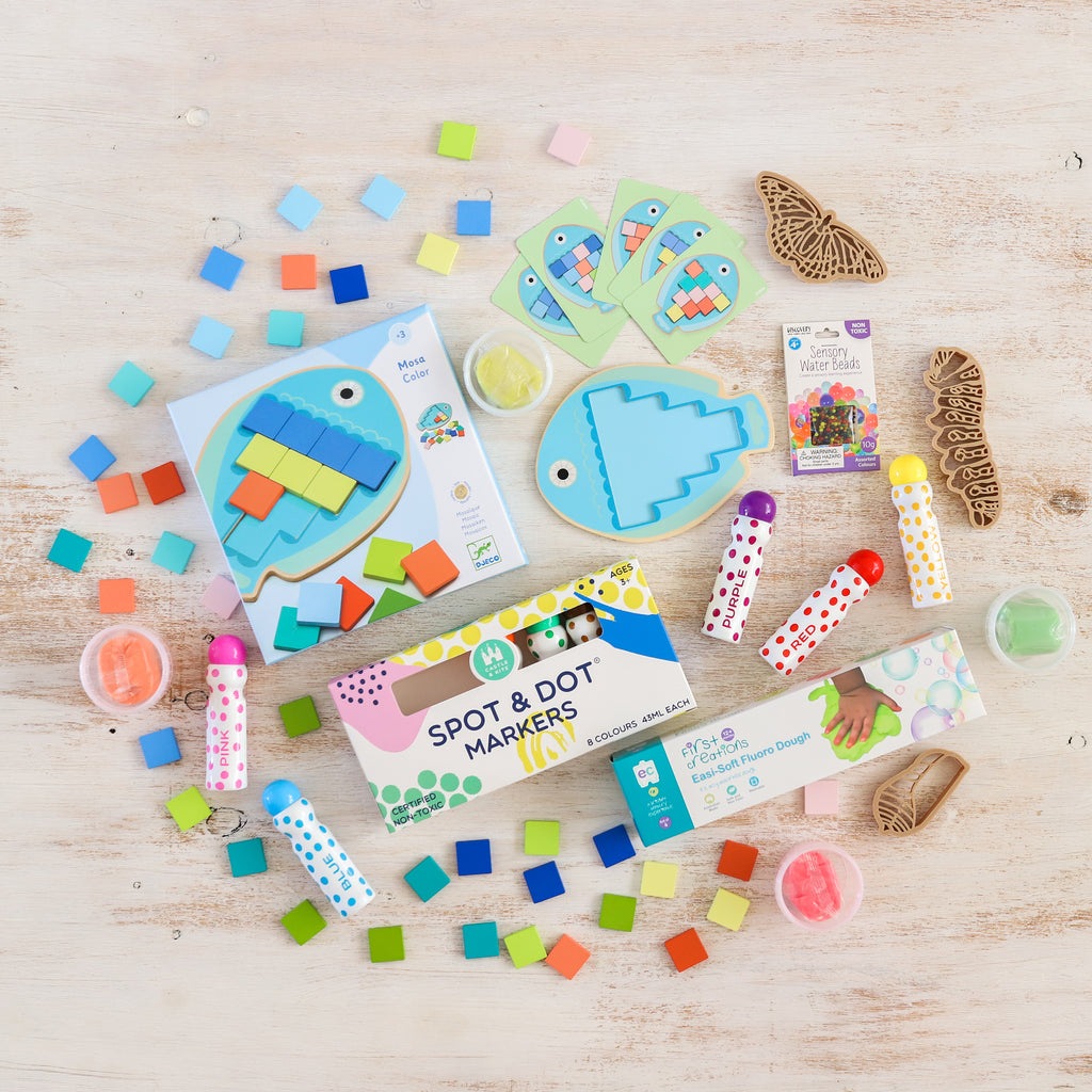 All creative toys spread out on floor from The Creative Toy Shop play box subscription for March 2021